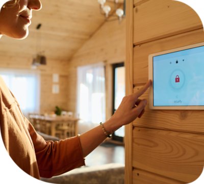 Woman using smart home device