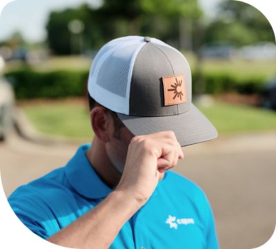 C Spire employee tipping his hat