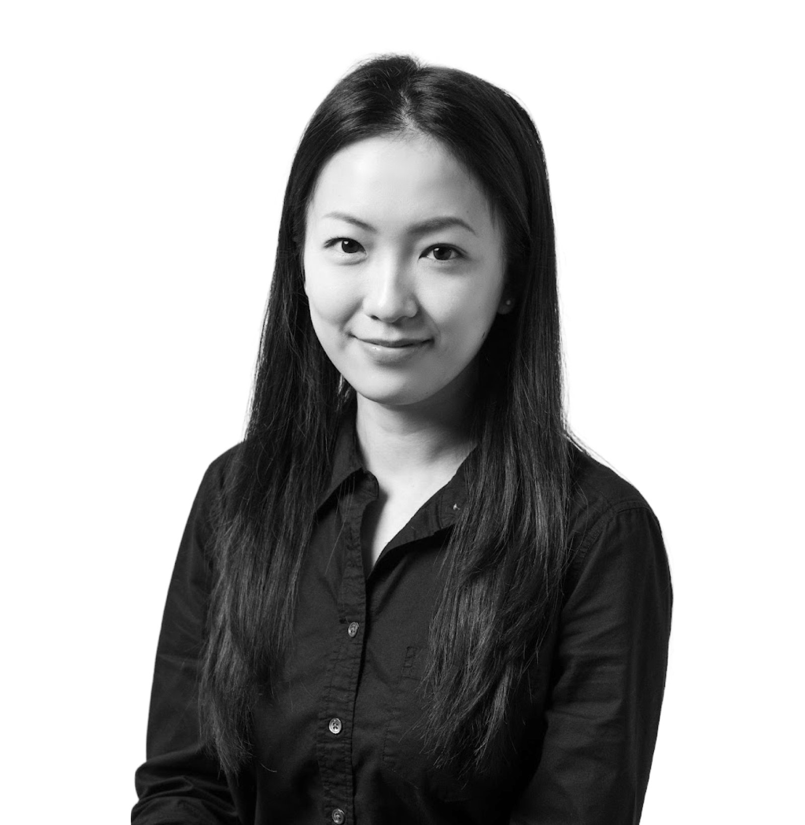 A woman with long, straight hair wearing a dark button-up shirt, facing forward and smiling slightly against a plain background.