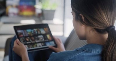 Woman using her iPad at home