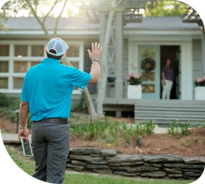 C Spire technician waving to a customer