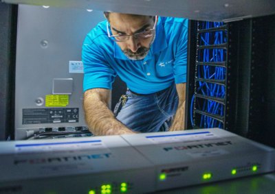 C Spire IT technician working with Managed IT Network