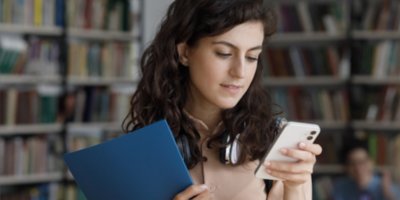 Girl in library on phone