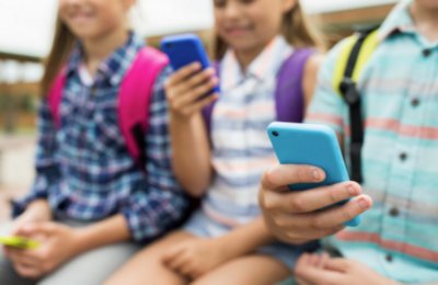 Children looking at their phones